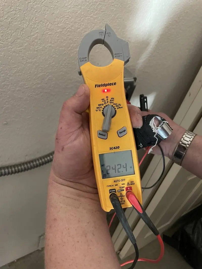 Voltage testing with clamp meter during Whole House Surge Protector in Smithsburg